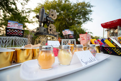 Table with Popcorn Toppings and Salt