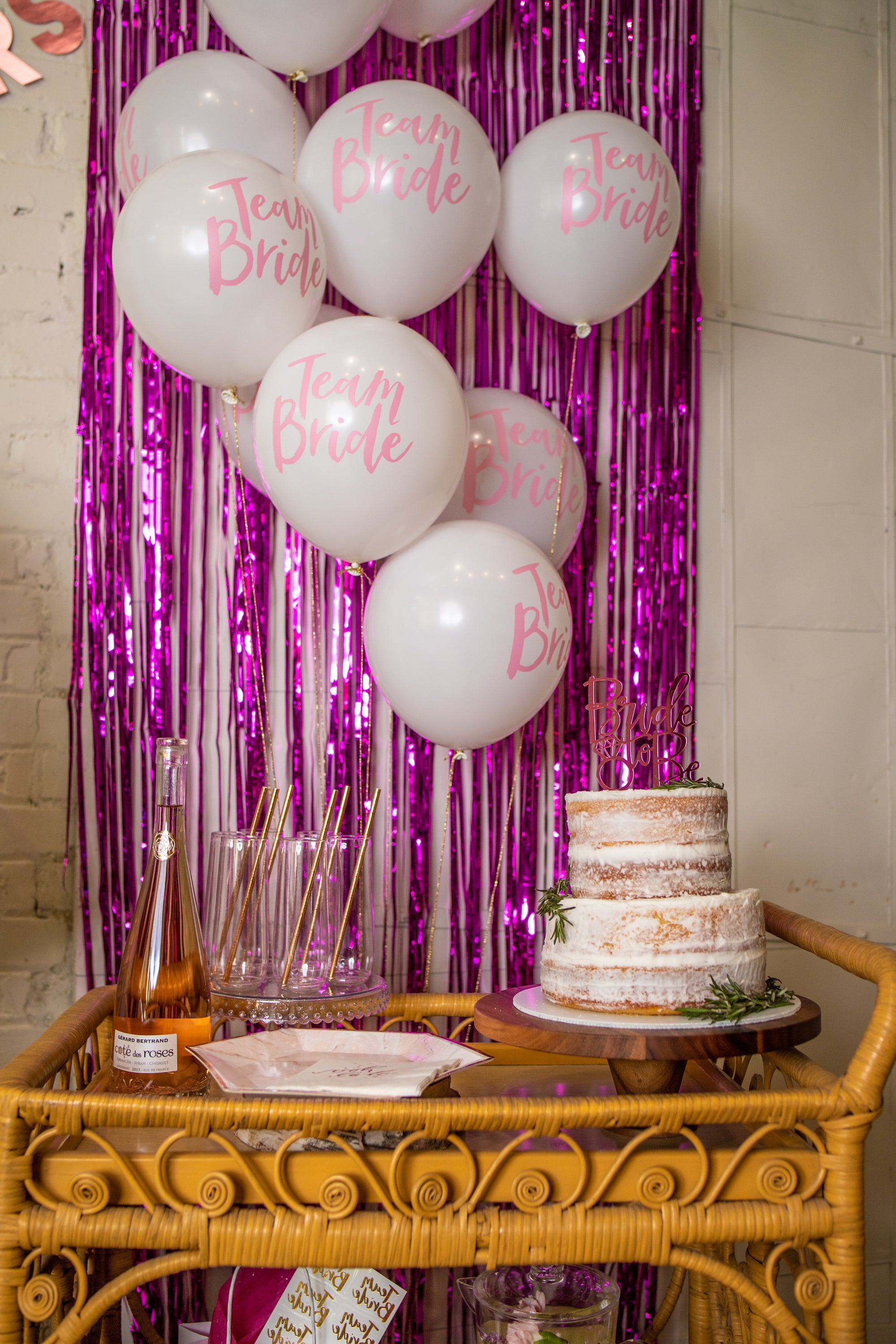 Pink Team Bride Balloons and Hot Pink Fringe Backdrop